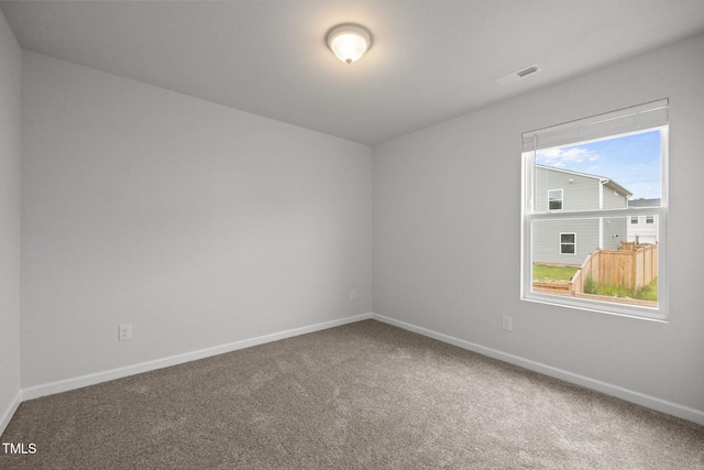 5404 Rutledgeville Ln, Knightdale, NC 27545 - carpeted empty room with baseboards
