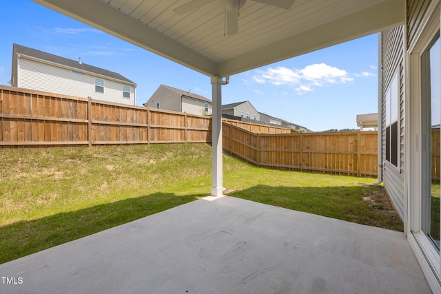 5404 Rutledgeville Ln, Knightdale, NC 27545 - fenced backyard featuring a patio area and a ceiling fan