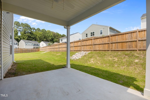5404 Rutledgeville Ln, Knightdale, NC 27545 - fenced backyard with a ceiling fan, a patio area, and a residential view