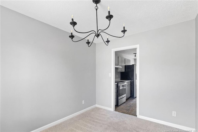 3326 Donnett Dr, Spring Lake, NC 28390 - unfurnished dining area featuring a chandelier, carpet flooring, and a textured ceiling