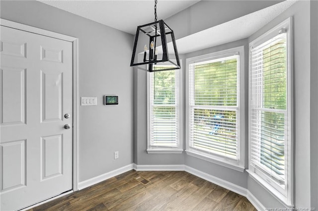 3326 Donnett Dr, Spring Lake, NC 28390 - unfurnished dining area featuring dark wood-style floors and plenty of natural light