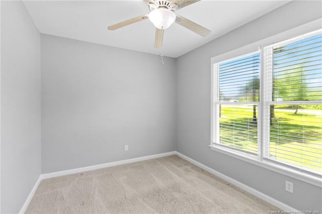 3326 Donnett Dr, Spring Lake, NC 28390 - spare room featuring plenty of natural light, light colored carpet, and ceiling fan