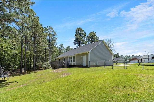 3326 Donnett Dr, Spring Lake, NC 28390 - rear view of house featuring a deck and a trampoline
