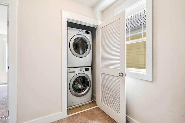 438 Granite Mill Blvd, Chapel Hill, NC 27516 - laundry area featuring stacked washer and clothes dryer and carpet flooring