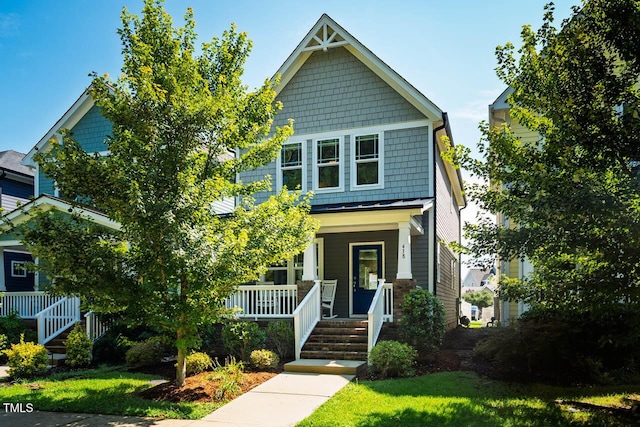 438 Granite Mill Blvd, Chapel Hill, NC 27516 - view of front of house featuring a porch, a front yard, and a standing seam roof