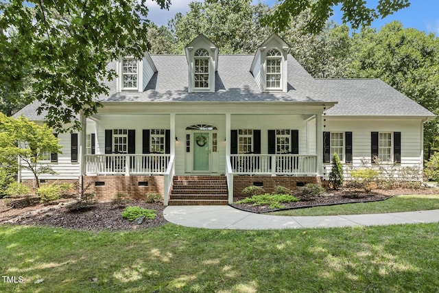 8916 Timberland Dr, Wake Forest, NC 27587 - cape cod-style house with crawl space, a porch, roof with shingles, and a front lawn