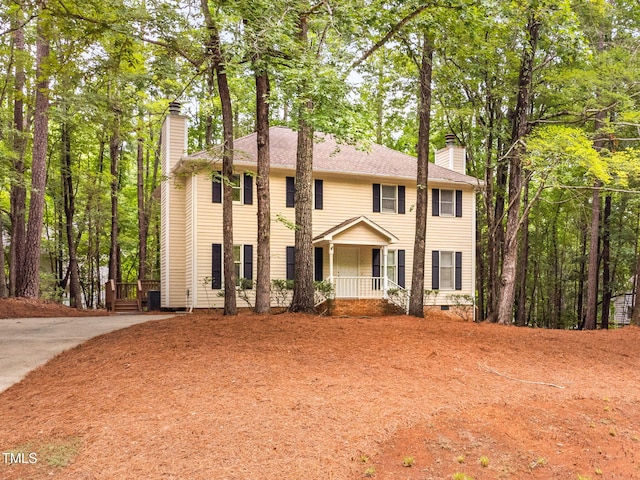 4316 American Dr, Durham, NC 27705 - colonial inspired home with a chimney and a porch