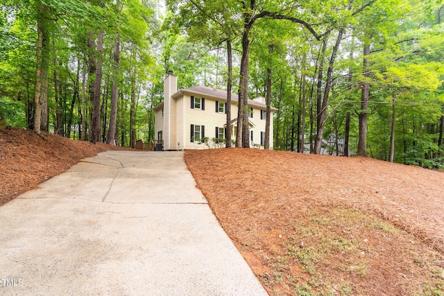 4316 American Dr, Durham, NC 27705 - colonial-style house with a chimney and concrete driveway