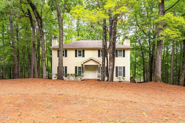 4316 American Dr, Durham, NC 27705 - colonial inspired home featuring a chimney and a porch