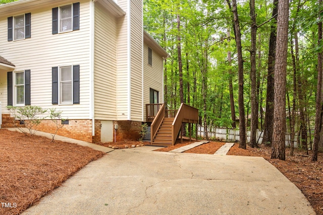 4316 American Dr, Durham, NC 27705 - view of property exterior featuring stairs and a wooden deck