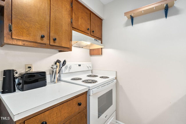 4316 American Dr, Durham, NC 27705 - kitchen with white electric range, under cabinet range hood, brown cabinetry, and light countertops