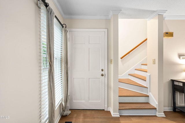 4316 American Dr, Durham, NC 27705 - entryway with wood finished floors, crown molding, and stairs