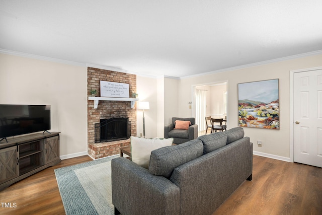 4316 American Dr, Durham, NC 27705 - living room featuring wood finished floors, crown molding, and a fireplace