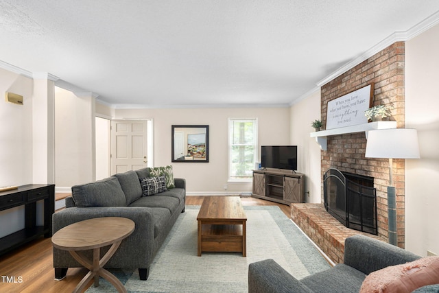 4316 American Dr, Durham, NC 27705 - living area with wood finished floors, ornamental molding, and a brick fireplace