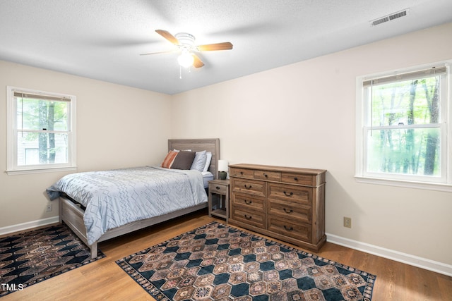 4316 American Dr, Durham, NC 27705 - bedroom with wood finished floors and a ceiling fan
