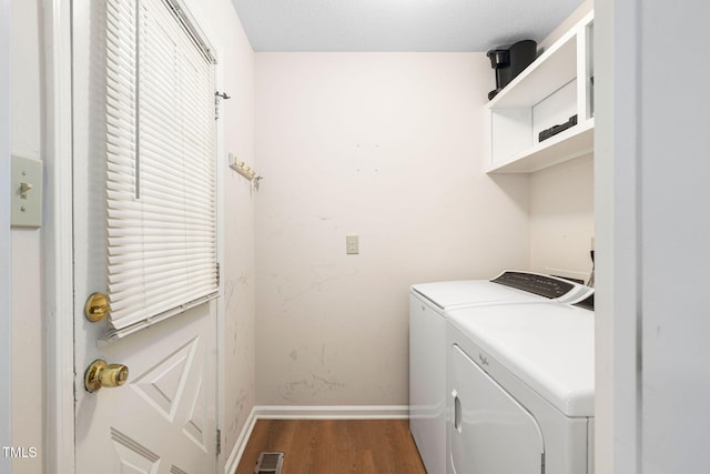 4316 American Dr, Durham, NC 27705 - washroom featuring independent washer and dryer and wood finished floors