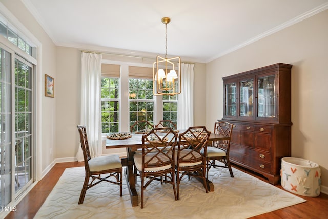 4104 Earl Grey Ct, Raleigh, NC 27612 - dining area with a chandelier, wood finished floors, and crown molding