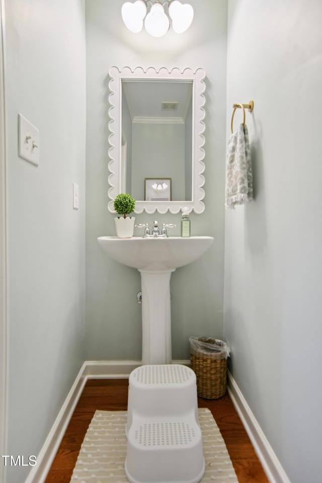 4104 Earl Grey Ct, Raleigh, NC 27612 - half bath featuring wood finished floors and crown molding