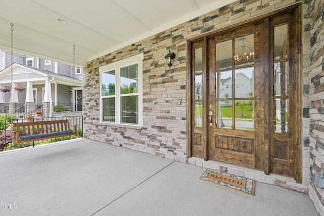 421 Gilpin Way, Cary, NC 27519 - entrance to property featuring covered porch and stone siding