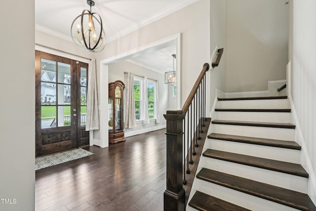 421 Gilpin Way, Cary, NC 27519 - foyer entrance with a chandelier, stairs, crown molding, and wood finished floors
