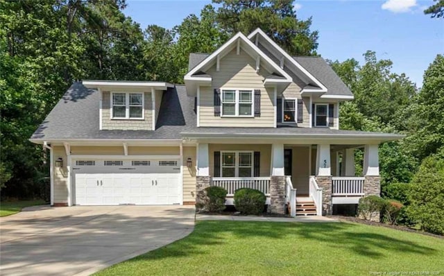 57 Spring Water Ct, Spring Lake, NC 28390 - craftsman house featuring concrete driveway, a porch, a front lawn, roof with shingles, and an attached garage