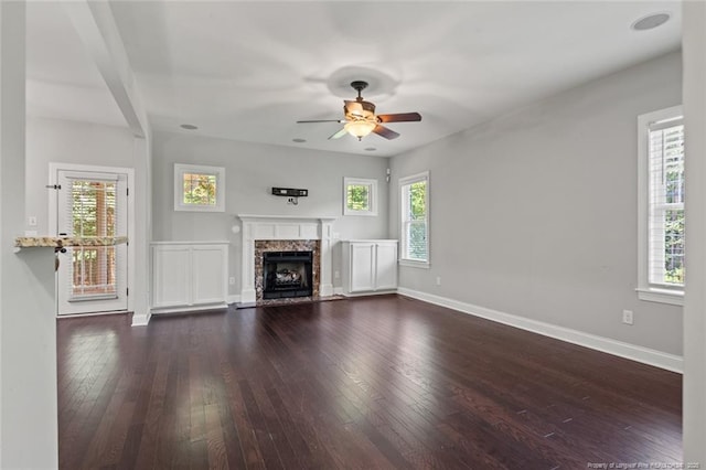 57 Spring Water Ct, Spring Lake, NC 28390 - unfurnished living room with a ceiling fan, a fireplace, and dark wood finished floors