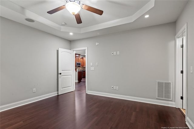 57 Spring Water Ct, Spring Lake, NC 28390 - unfurnished bedroom featuring a raised ceiling, recessed lighting, wood finished floors, and a ceiling fan