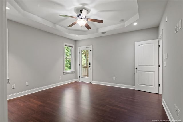 57 Spring Water Ct, Spring Lake, NC 28390 - spare room featuring a raised ceiling, a ceiling fan, dark wood finished floors, and recessed lighting