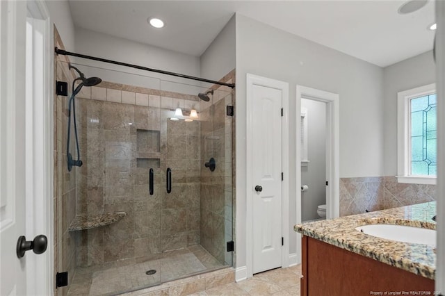 57 Spring Water Ct, Spring Lake, NC 28390 - bathroom featuring vanity, a shower stall, and tile patterned floors
