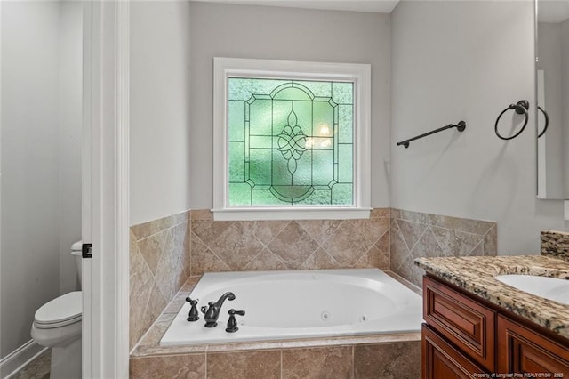 57 Spring Water Ct, Spring Lake, NC 28390 - bathroom with a whirlpool tub, vanity, and healthy amount of natural light