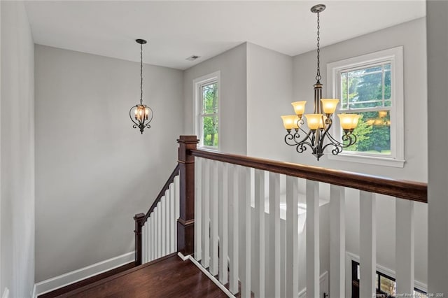 57 Spring Water Ct, Spring Lake, NC 28390 - stairway with a chandelier, healthy amount of natural light, and wood finished floors