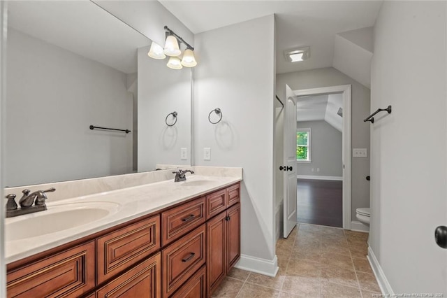 57 Spring Water Ct, Spring Lake, NC 28390 - bathroom with double vanity, lofted ceiling, and tile patterned floors