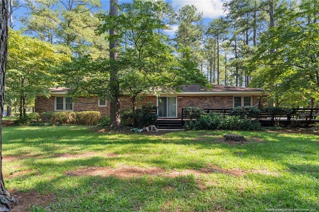 5945 Muscat Rd, Hope Mills, NC 28348 - rear view of property featuring brick siding and a lawn