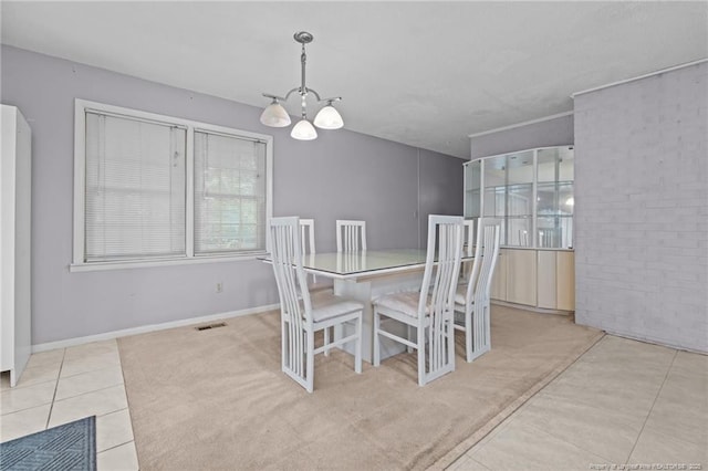 5945 Muscat Rd, Hope Mills, NC 28348 - tiled dining area featuring a chandelier and baseboards