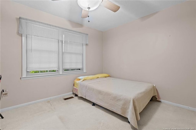 5945 Muscat Rd, Hope Mills, NC 28348 - carpeted bedroom featuring baseboards and a ceiling fan