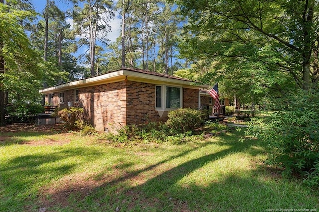 5945 Muscat Rd, Hope Mills, NC 28348 - view of side of property with brick siding and a lawn