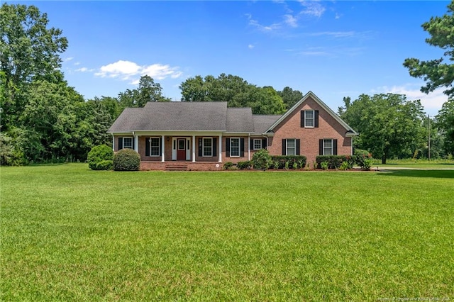 1438 Division Pl, Fayetteville, NC 28312 - view of front facade with a front lawn, brick siding, and covered porch