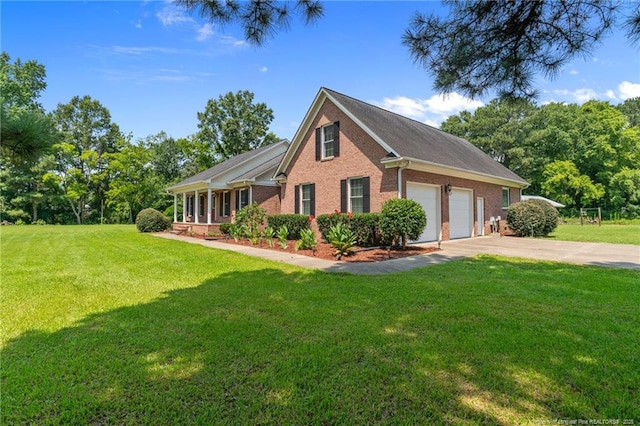 1438 Division Pl, Fayetteville, NC 28312 - view of front of property featuring brick siding, concrete driveway, a front lawn, and a garage