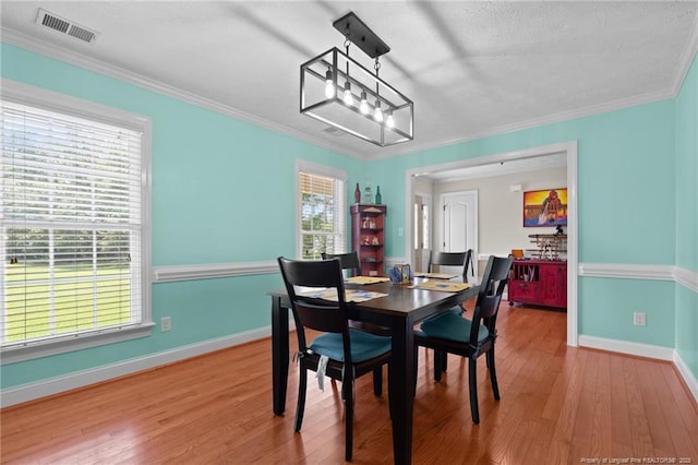 1438 Division Pl, Fayetteville, NC 28312 - dining area with wood finished floors and ornamental molding