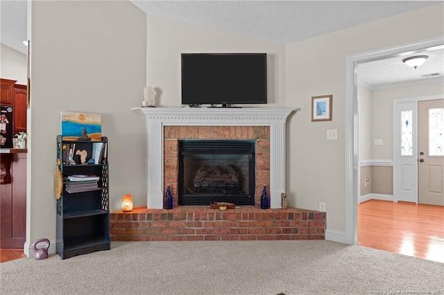 1438 Division Pl, Fayetteville, NC 28312 - living room featuring a brick fireplace, carpet, and vaulted ceiling