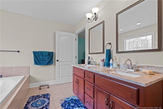 1438 Division Pl, Fayetteville, NC 28312 - bathroom featuring double vanity, a garden tub, and tile patterned flooring