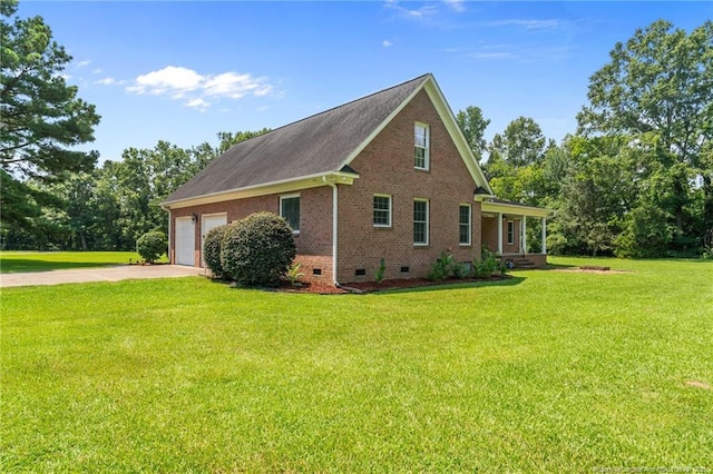 1438 Division Pl, Fayetteville, NC 28312 - view of side of property with crawl space, brick siding, concrete driveway, a garage, and a yard