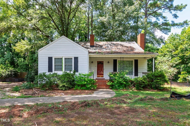 322 Jones Franklin Rd, Raleigh, NC 27606 - bungalow featuring a chimney and covered porch