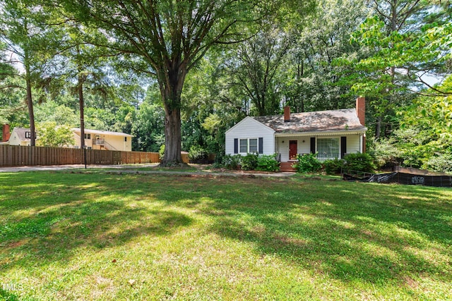 322 Jones Franklin Rd, Raleigh, NC 27606 - view of front of house featuring a chimney and covered porch