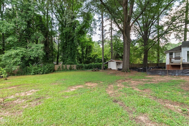 322 Jones Franklin Rd, Raleigh, NC 27606 - fenced backyard featuring a shed and a wooden deck