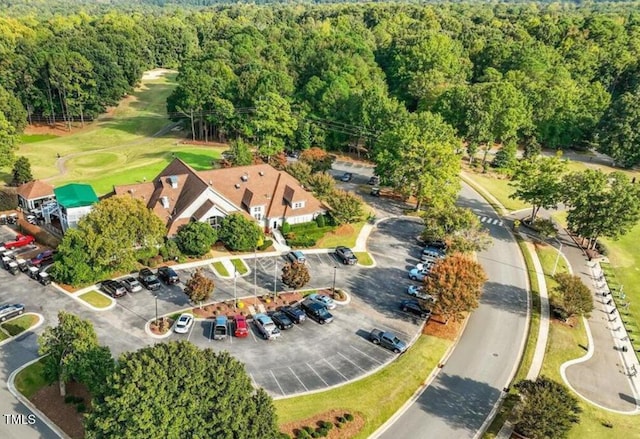 5004 Sunset Forest Cir, Holly Springs, NC 27540 - aerial view of property's location featuring a heavily wooded area and a local golf course