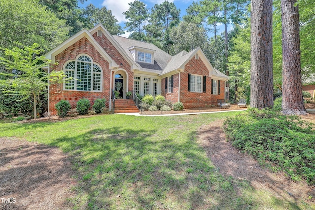 5004 Sunset Forest Cir, Holly Springs, NC 27540 - view of front of home with brick siding and a front yard