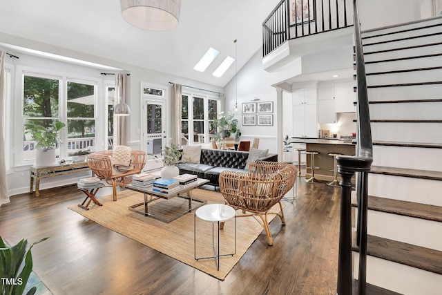 5004 Sunset Forest Cir, Holly Springs, NC 27540 - living area with plenty of natural light, stairs, high vaulted ceiling, and dark wood-type flooring