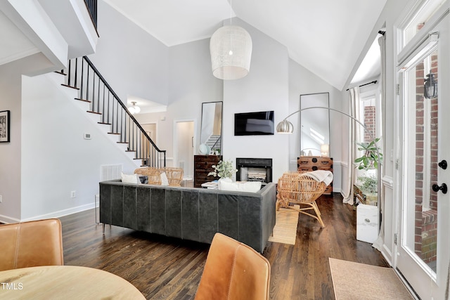 5004 Sunset Forest Cir, Holly Springs, NC 27540 - living area featuring stairs, high vaulted ceiling, dark wood-style floors, and a fireplace