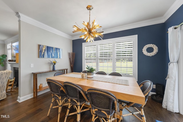 210 Meadow Lake Dr, Youngsville, NC 27596 - dining room with crown molding, wood finished floors, a chandelier, and a fireplace